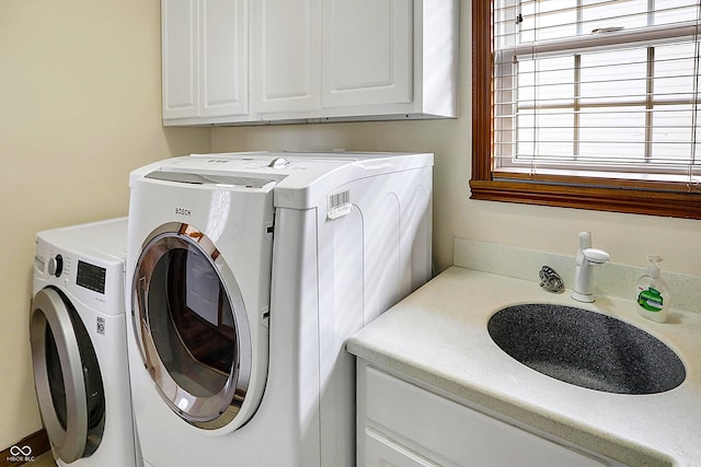 laundry room featuring sink and washer and clothes dryer