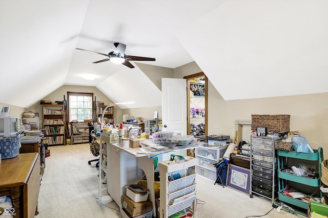 carpeted office space with ceiling fan and lofted ceiling