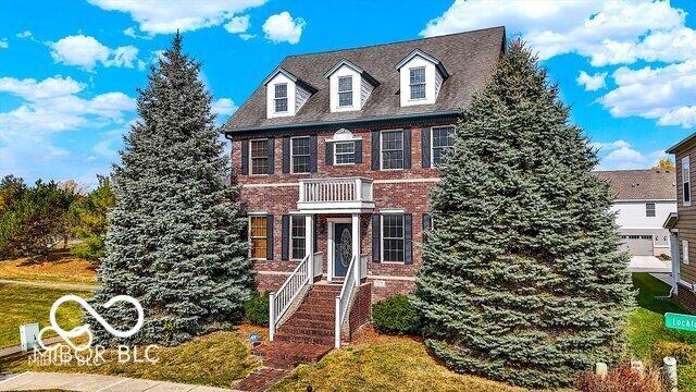 view of front of home featuring brick siding