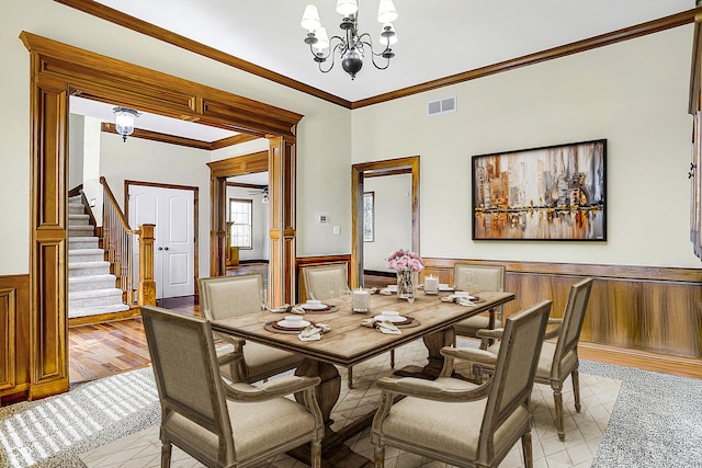 7178 Lockford N, Avon, IN 46123 - dining room featuring an inviting chandelier, wainscoting, stairs, visible vents, and ornamental molding