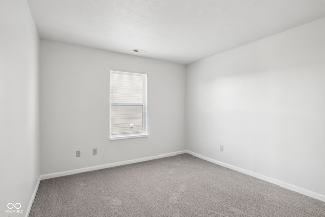 unfurnished room with carpet