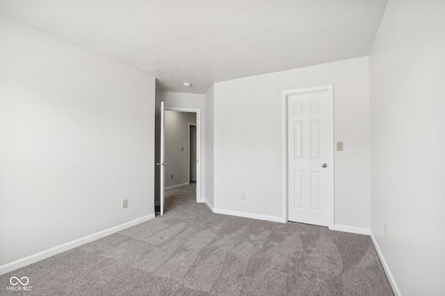 unfurnished bedroom featuring light colored carpet