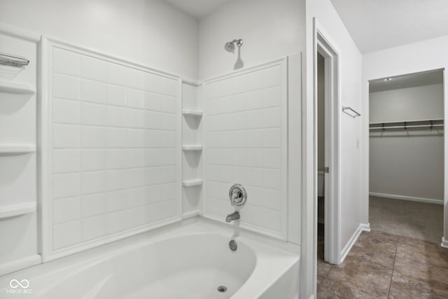 bathroom featuring bathtub / shower combination and tile patterned flooring