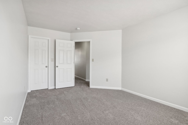 unfurnished bedroom with carpet flooring