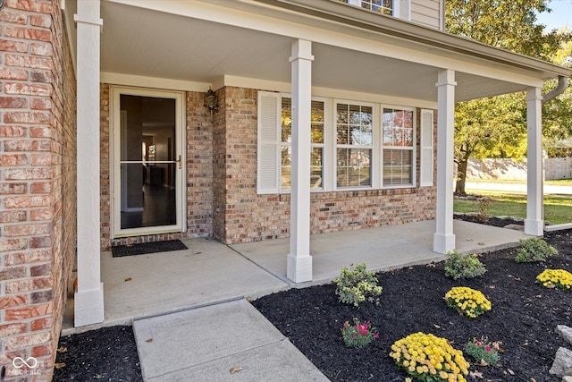 property entrance with covered porch