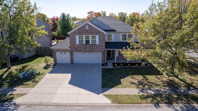 front of property with a front lawn and a garage