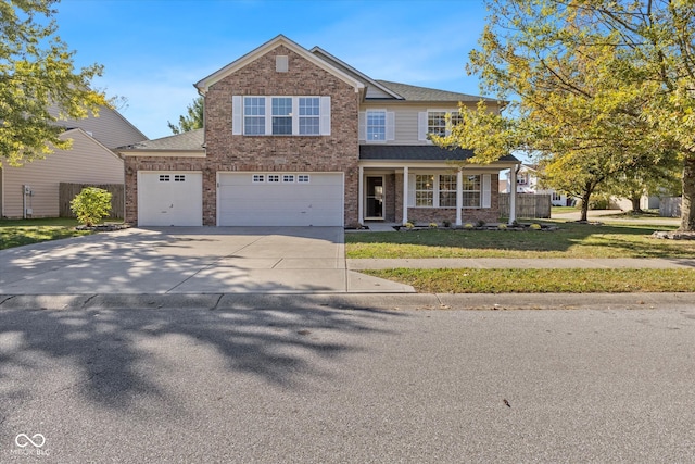 view of front of house featuring a front lawn and a garage