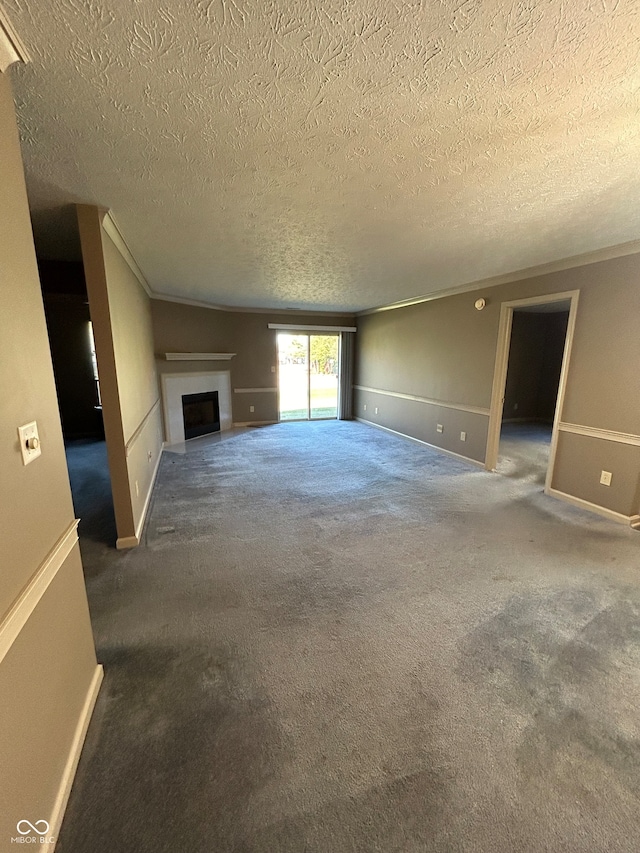 unfurnished living room featuring crown molding, a textured ceiling, and dark carpet