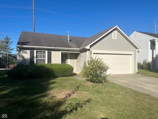 view of front facade with a front yard and a garage