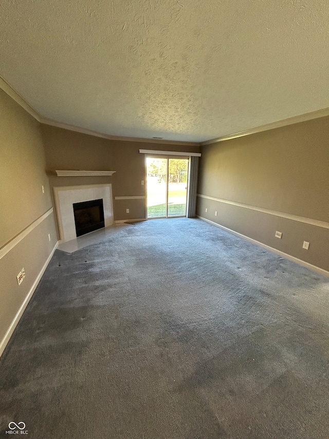 unfurnished living room featuring crown molding, dark colored carpet, and a textured ceiling