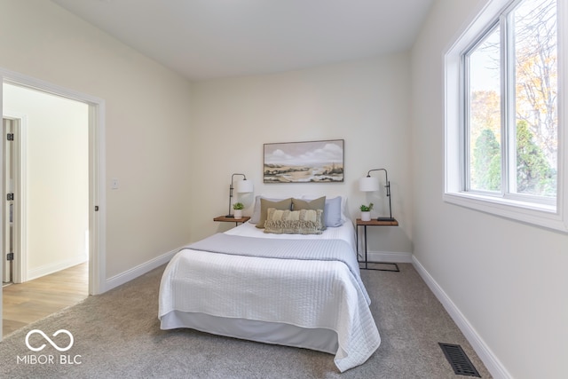 bedroom with light wood-type flooring