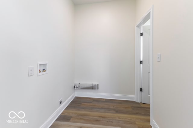 washroom featuring dark wood-type flooring and washer hookup