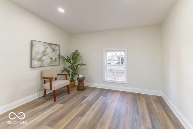 unfurnished room with light wood-type flooring