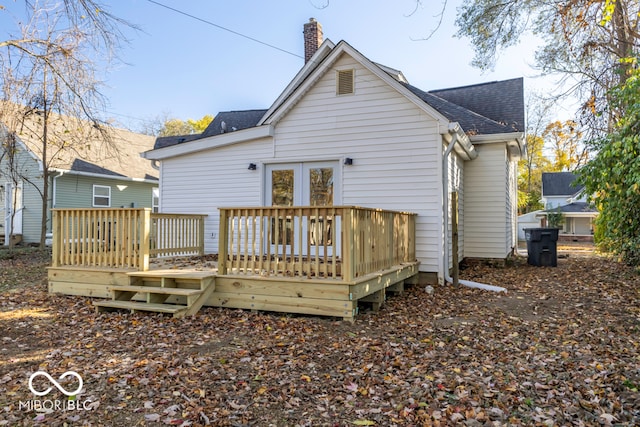 back of property with a wooden deck