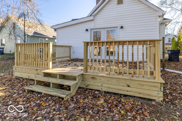 rear view of house with a wooden deck