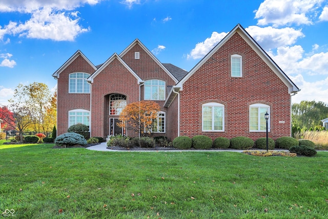 view of property featuring a front lawn