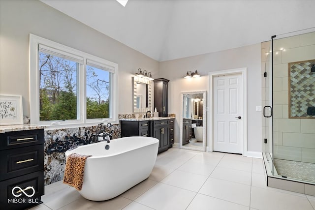 bathroom with vanity, tile patterned floors, and independent shower and bath