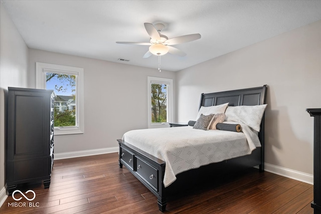 bedroom featuring ceiling fan and dark hardwood / wood-style flooring