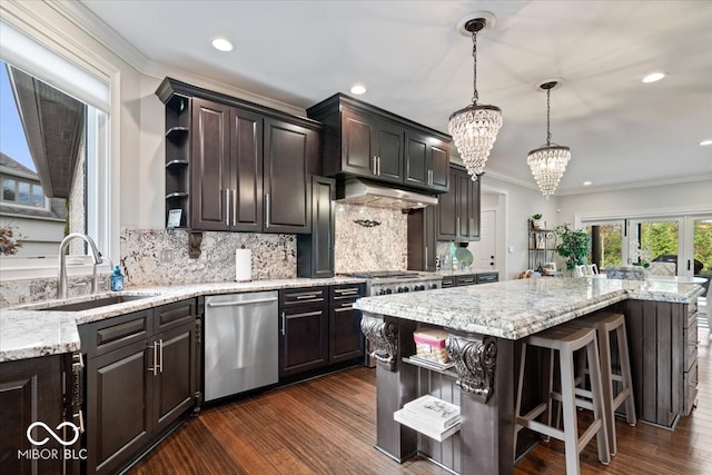 kitchen featuring dishwasher, a kitchen island, sink, dark brown cabinetry, and dark hardwood / wood-style flooring