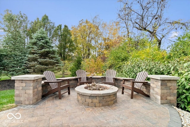 view of patio / terrace featuring an outdoor fire pit