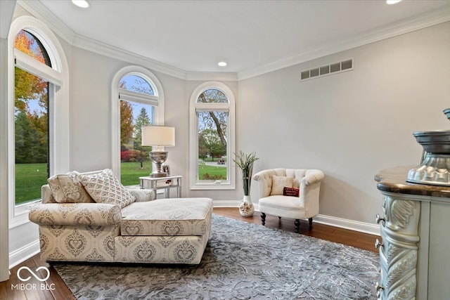 sitting room featuring crown molding and hardwood / wood-style floors