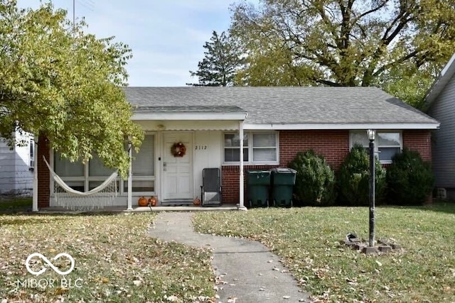 view of front of property with a front lawn