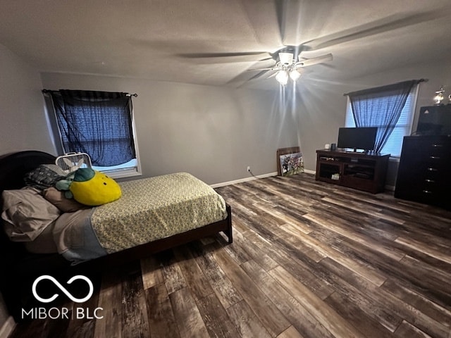 bedroom featuring wood-type flooring and ceiling fan