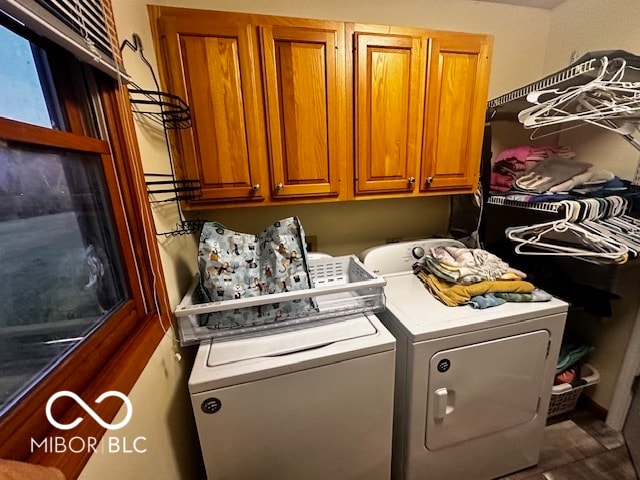 laundry area featuring cabinets and washer and clothes dryer