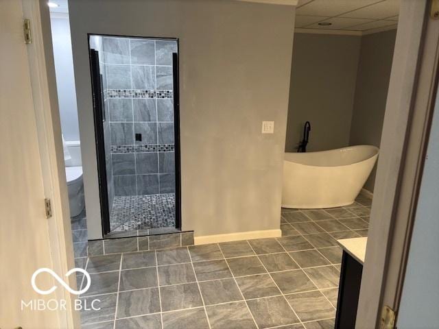 full bathroom featuring tile patterned floors, toilet, shower with separate bathtub, vanity, and a drop ceiling