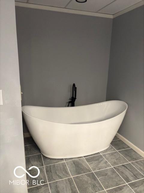 bathroom featuring tile patterned floors and a bathtub