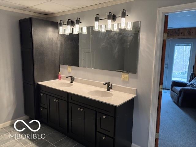 bathroom featuring crown molding and vanity