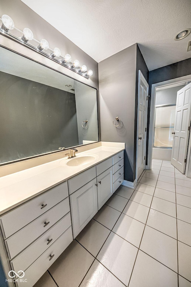 808 Copperfield Xing, Danville, IN 46122 - full bath with tile patterned floors, vanity, a textured ceiling, and baseboards