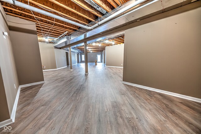 basement featuring hardwood / wood-style floors