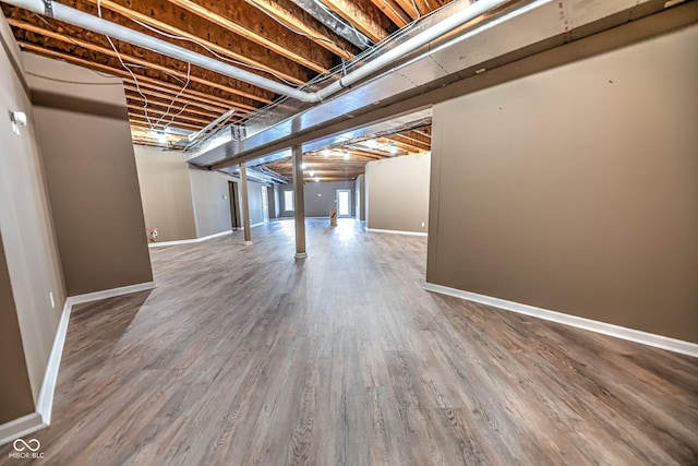 808 Copperfield Xing, Danville, IN 46122 - below grade area featuring wood finished floors and baseboards