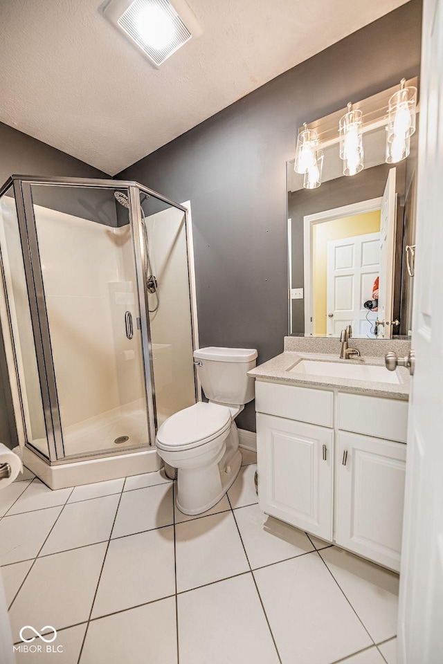 808 Copperfield Xing, Danville, IN 46122 - full bathroom with a shower stall, tile patterned floors, vanity, toilet, and baseboards