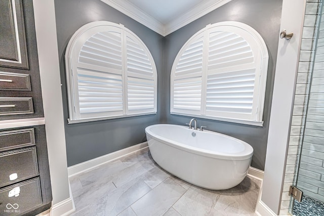 808 Copperfield Xing, Danville, IN 46122 - full bath with ornamental molding, a soaking tub, baseboards, and marble look tile flooring