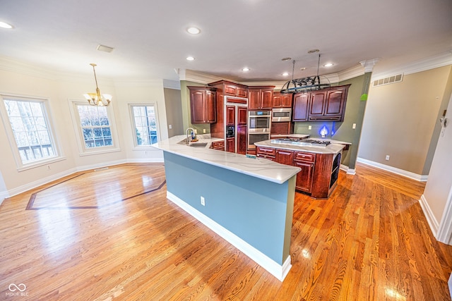 kitchen featuring kitchen peninsula, a wealth of natural light, and dark hardwood / wood-style floors