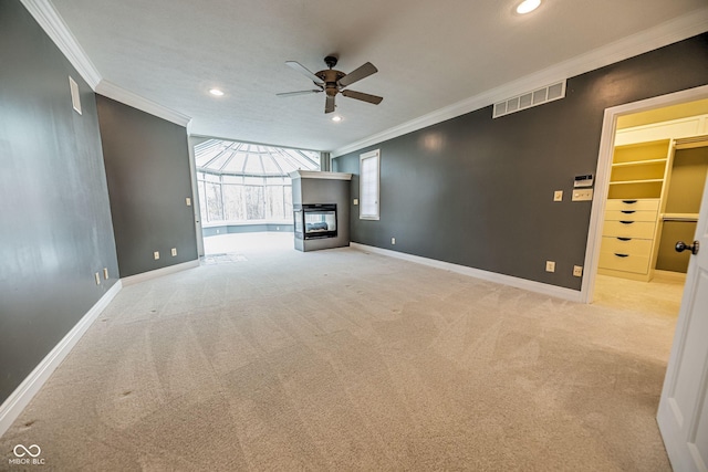 808 Copperfield Xing, Danville, IN 46122 - unfurnished living room featuring ornamental molding, ceiling fan, baseboards, carpet flooring, and recessed lighting