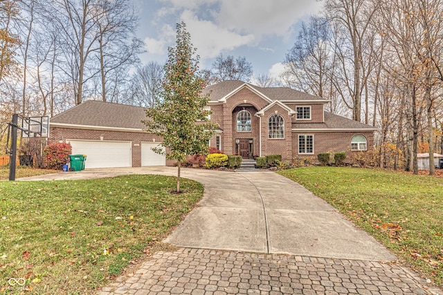 view of front of property with a garage and a front yard