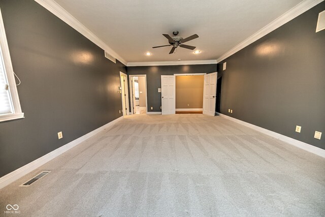 interior space featuring ceiling fan and crown molding