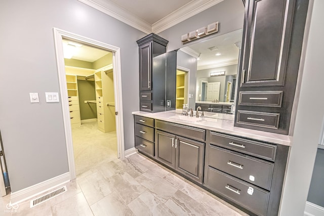 808 Copperfield Xing, Danville, IN 46122 - bathroom featuring ornamental molding, vanity, baseboards, a spacious closet, and marble finish flooring