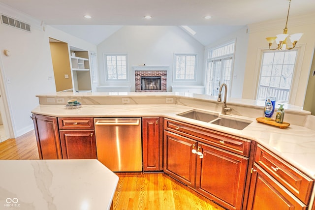 808 Copperfield Xing, Danville, IN 46122 - kitchen featuring dishwasher, a sink, lofted ceiling, a chandelier, and light wood-style floors