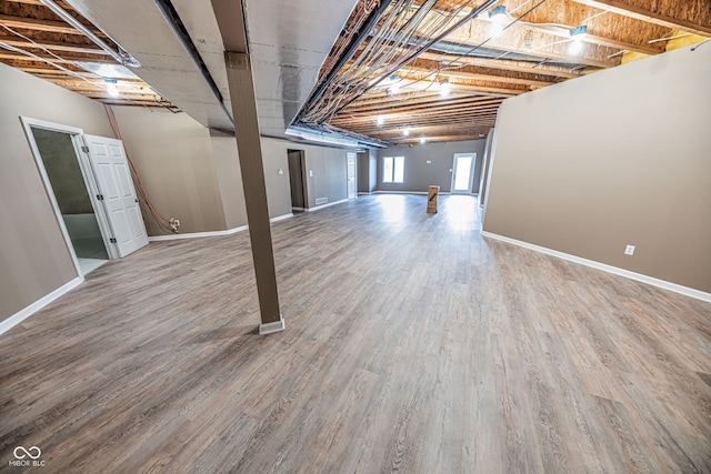 basement featuring hardwood / wood-style floors