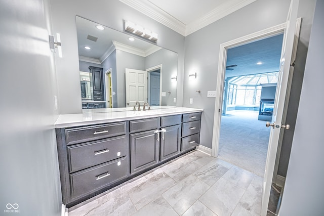 bathroom featuring vanity and ornamental molding