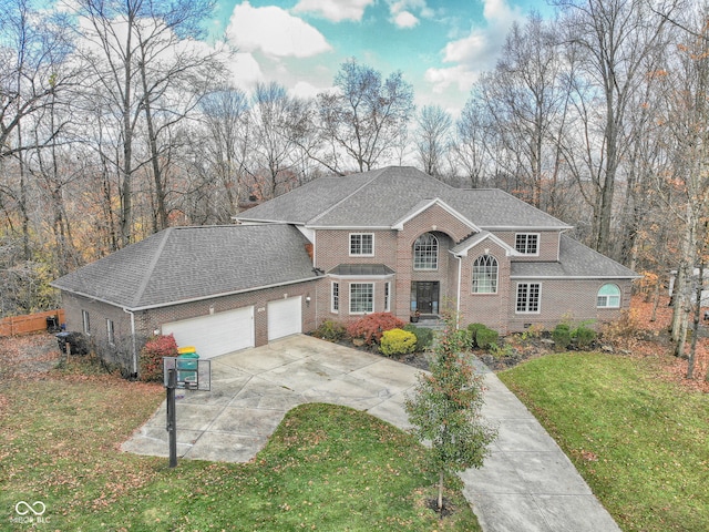 view of front of house featuring a garage and a front yard