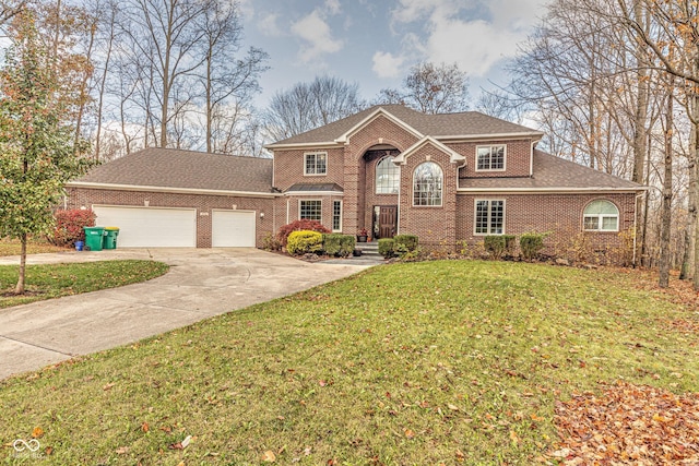 808 Copperfield Xing, Danville, IN 46122 - view of front facade with driveway, a garage, brick siding, a front lawn, and a shingled roof