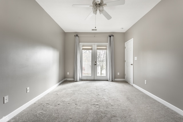 unfurnished room with french doors, light carpet, and ceiling fan