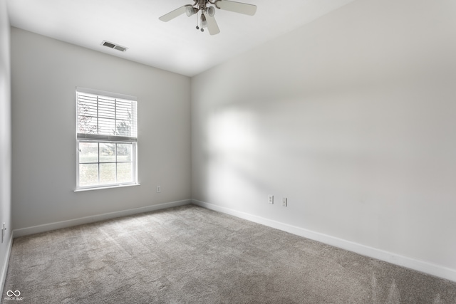 carpeted empty room with ceiling fan