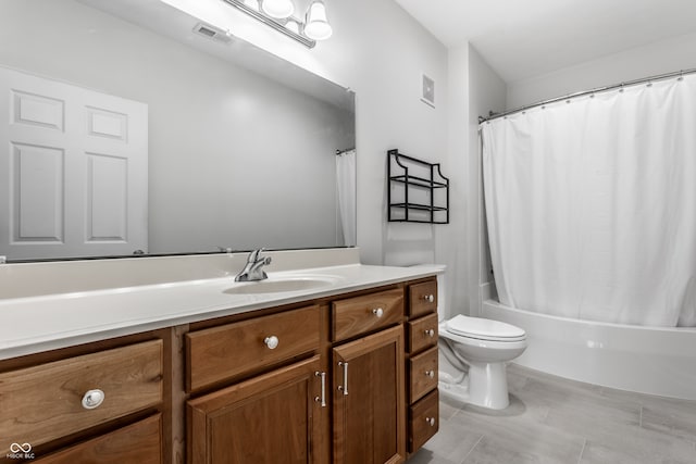 full bathroom featuring vanity, toilet, and shower / tub combo with curtain