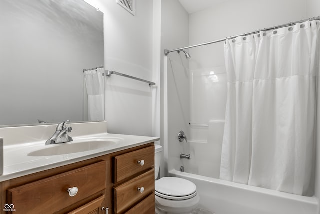 full bathroom with toilet, shower / tub combo, and vanity